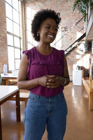 Smiling African American Woman in Modern Urban Office Setting