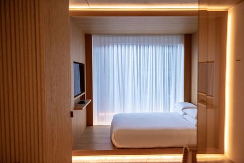 Minimalist modern bedroom with soft lighting design