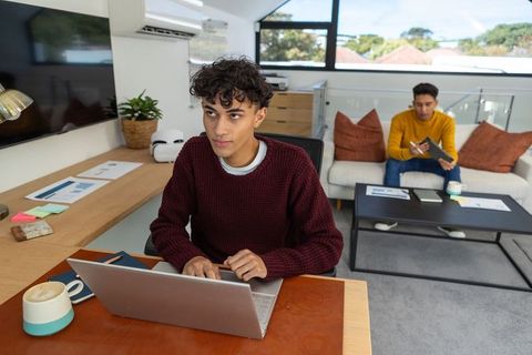 Young Professionals Collaborating in Modern Loft Workspace