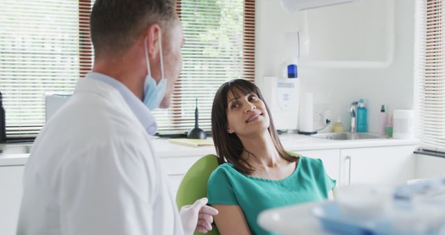 Dentist Consulting Patient in Modern Dental Clinic - Download Free Stock Images Pikwizard.com