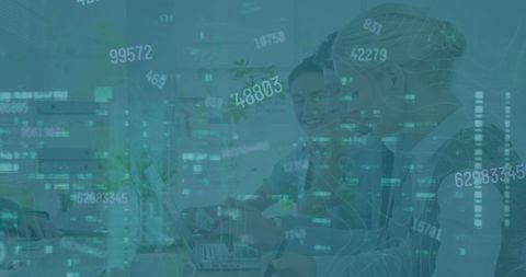 Diverse Female Professionals Analyzing Financial Graphs in Office