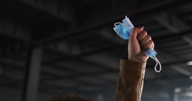 Person Holding Surgical Masks in Raised Hand - Download Free Stock Images Pikwizard.com