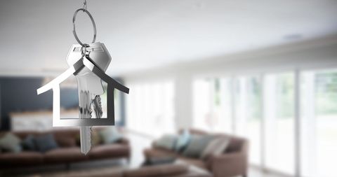 Silver House Key in Modern Living Room Interior Concept - Download Free Stock Images Pikwizard.com