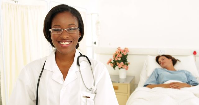 Smiling Female Doctor in Hospital Room with Patient - Download Free Stock Images Pikwizard.com