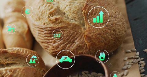 Artisanal Sourdough Loaf on Rustic Parchment with Seeds and Eco Sustainability Icons