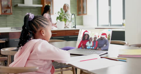Child Enjoying Virtual Christmas Celebration with Family