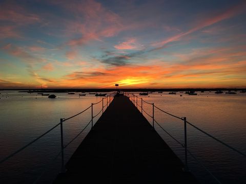 Serene walkway at dusk with vibrant road sunset skies