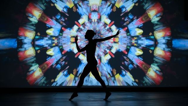 Silhouette of dancer elegantly gliding with vibrant abstract background