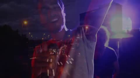 Singer Performing Live Under Dramatic Light Trails