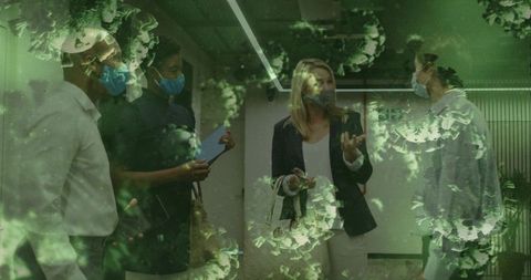 Office team wearing masks discussing safety protocols with virus overlay double exposure