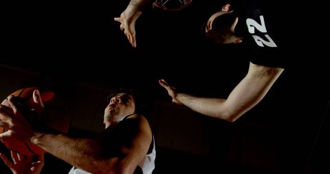Intense Basketball Match Between Two Players in Indoor Arena - Download Free Stock Images Pikwizard.com