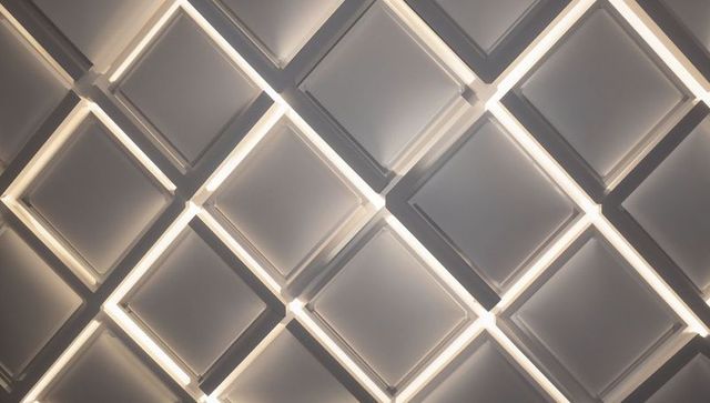 Diagonal led-edged square ceiling panels creating geometric grid and ambient glow