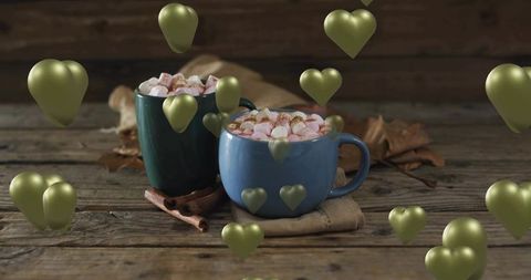 Cozy hot chocolate with marshmallows and cinnamon sticks in rustic blue and green mugs