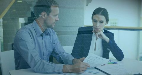 Focused Business Team Analyzing Reports