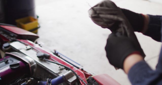 Mechanic Cleaning Hands Next to Open Car Engine - Download Free Stock Images Pikwizard.com