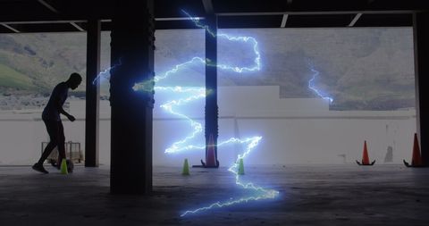 Man practicing soccer with dynamic lightning effect overlay