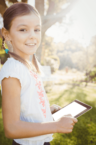 Young Girl Smiling Holding Tablet Under Sunny Sky Outside Transparent - Download Free Stock Videos Pikwizard.com