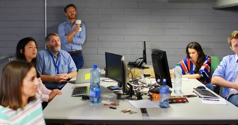 Diverse Team in Modern Office Collaborating on Project