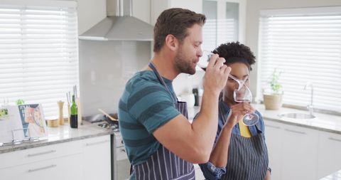Happy Couple Enjoying Wine in Modern Kitchen - Download Free Stock Images Pikwizard.com
