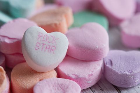 Close-up of colorful candy hearts with playful messages