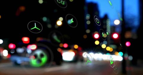 Green energy icons overlay transporting night cityscape procedure