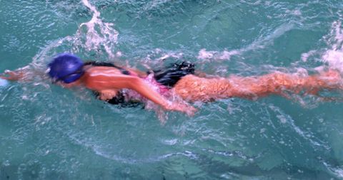 Female Swimmer Performing Front Stroke in Pool - Download Free Stock Images Pikwizard.com