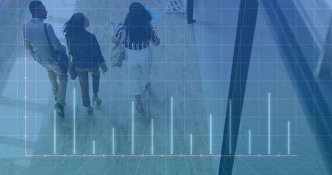 Corporate team walking through digital data overlay in modern office lobby