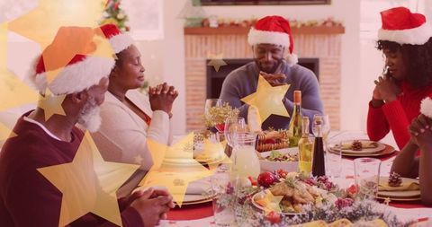 Family Celebrating a Christmas Meal in Joyous Spirit