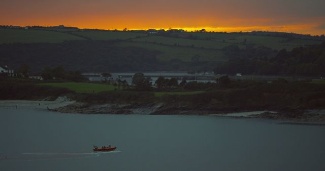 Fishermen on Boat at Dusk with Scenic Landscape - Download Free Stock Images Pikwizard.com