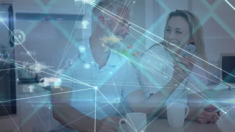 Smiling Couple Engaging with Digital Network Interface