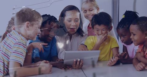 Teacher guiding diverse children using tablet for collaborative learning and curiosity