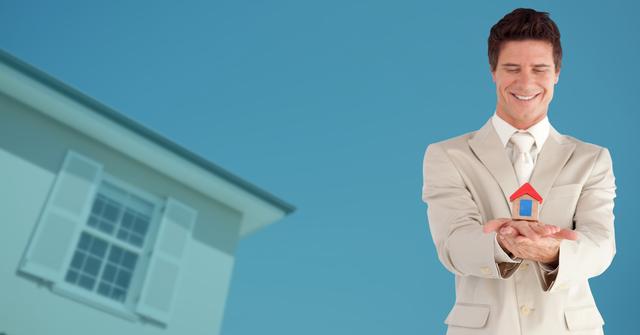 Digital composite image of smiling businessman holding house model