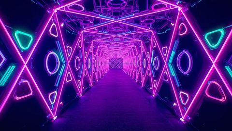 Glowing Neon Geometric Tunnel Leading Toward Patterned Backdrop with X Frames and Circles