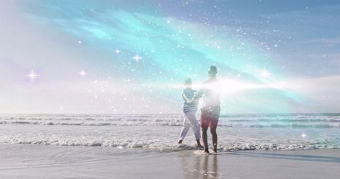 Mother and Son Enjoying Tranquil Beach Moment Under Starry Sky