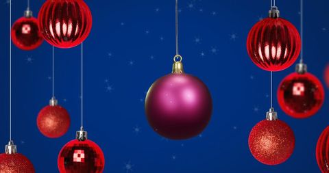 Shiny Purple and Red Christmas Baubles on Blue Winter Background - Download Free Stock Images Pikwizard.com