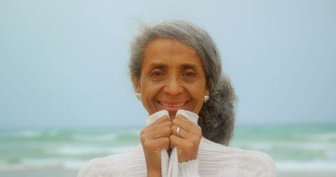 Senior Woman Enjoying Tranquil Beach Moment