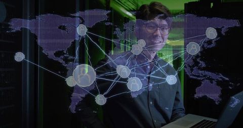 It specialist with world map hologram in data center environment