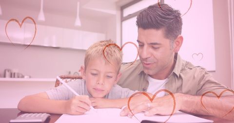 Father and Child Bonding During Homework Time with Heart Overlay