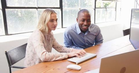 Diverse Team Collaborating at Desk with Computer - Download Free Stock Images Pikwizard.com