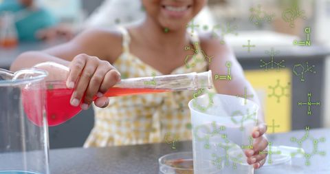 Child Conducting Chemistry Experiment with Colorful Formulas