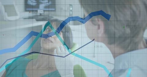 Dentist examining woman in dental chair with analytics chart overlay for health data
