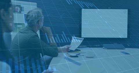 Senior executive analyzing data in modern meeting room