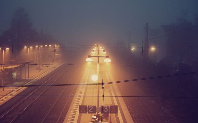 Lights Illumining Empty Train Platform on a Foggy Night - Download Free Stock Photos Pikwizard.com