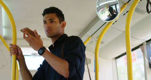 Young Man Using Smartphone in Public Transport Bus - Download Free Stock Images Pikwizard.com