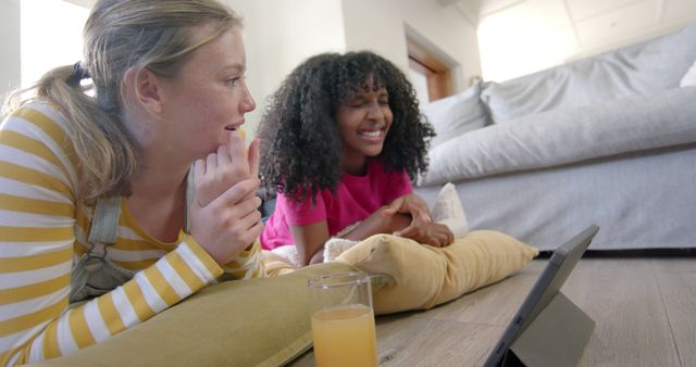 Girls Watching Tablet and Relaxing at Home on Floor - Download Free Stock Images Pikwizard.com