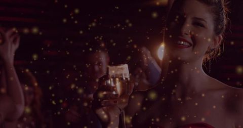 Elegant Woman Enjoying Nightclub Celebration with Bubbles