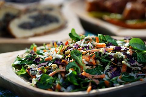 Fresh mixed greens and shredded carrot slaw with red cabbage, herbs and sunflower seeds