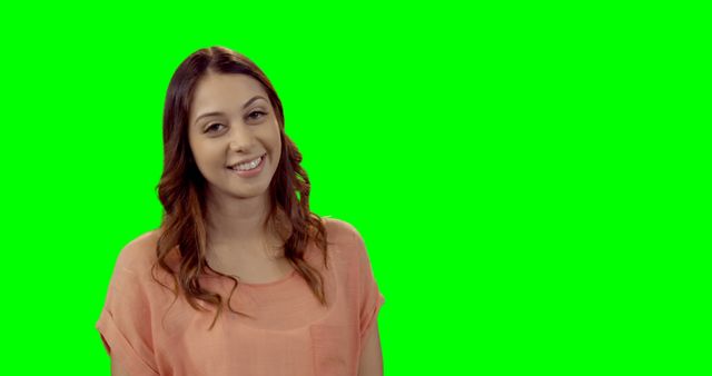 Cheerful Woman with Wavy Hair Smiling Against Green Screen - Download Free Stock Images Pikwizard.com