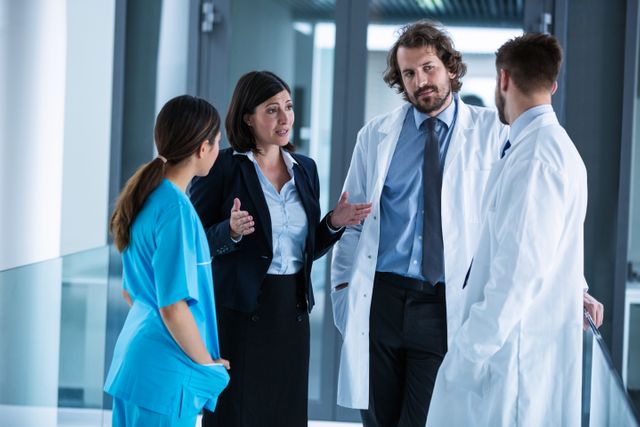 Businesswoman interacting with doctors - Download Free Stock Photos Pikwizard.com