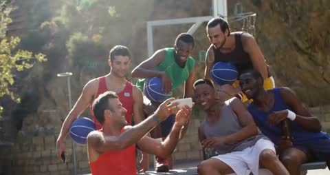 Energetic Teammates Capturing Memory on Outdoor Court